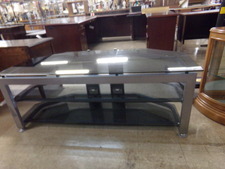 5 FT WIDE TV TABLE.  Smoked glass makes up most of this silver framed unit.  Has 2 shelves for other equipment.
$170.00