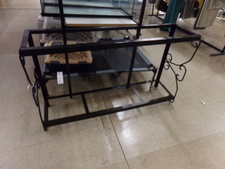 FISH AQUARIUM STAND.  This metal stand is 4 ft long.  Displayed with Pet supplies, but also could be support for other items, or a board on top for counter space or plants.
$30.00