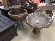 CONCRETE 2-bowl fountain.  Does not come with any pump workings.  Actually painted a dark brown.  This is the one to the left in pictures
$31.80