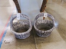 CONCRETE PLANTER POTS.  Big baskets with handles.  These are sold separately.   about 20