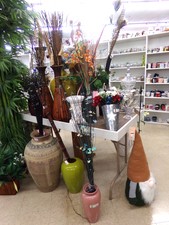decorate with artificial plants.  Featured price is the pink vase in the front the branches that come with it are lighted butterflies.  Find towards baby department
$11.50