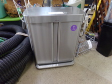 DOUBLE TRASH CAN.  Stainless steel with step-on lid raise.  Find in hardware area.
$90.00