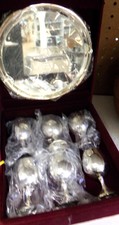 Silver communion set with platter and 6 cups in a red velvet box
$15.00