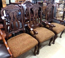 Dark wood dining chairs - 4 pc set - upholstery is brown/red paisley 
$85.00