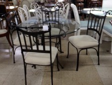 Black metal frame table and 4 chairs
Round glass top 
White seat cushions
$550.00