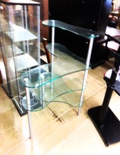 Unusual glass display shelf.  The glass is cut in unusual rounded shapes set at different angles.  The glass is very thick and this would hold up for commercial displaying.  
$278.50