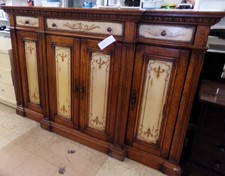 Tall cabinet. Golden pine with hand painted details. Displayed in our bedroom dressers, but is taller than an average dresser and could be used in anyroom of your home. 3 drawers 3 cabinets
$1295.00