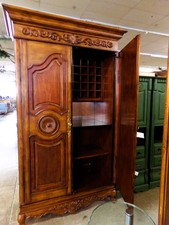 Beautiful walnut stained wood cabinet.  Is set up inside for a bar - has bottle racks and counter top.  But useful for a beautiful way to store crafts or other items.  Large - over 7 ft tall
$1895.00