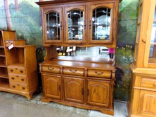 OAK HUTCH.  This oak hutch is 5 ft wide.  Has mirror backing and beveled glass doors.
$731.30