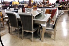 SILVER DINING SET.  A very fancy design where the high-back chairs have gemstone accented padded seats.  Extra leaf for even more sitting.   table, leaf & 6 chairs
$371.30