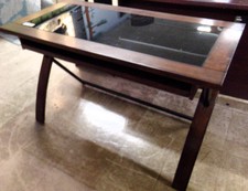 Dark wood and black glass desk
$101.30