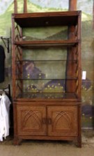 Rattan/wicker shelf with lower cabinet.  This unit is very large.  7 ft tall and 18