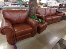 SMOOTH LEATHER.  Brown Couch, Chair and Ottoman sold as a set.  In new condition.  
$971.30