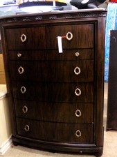 Dark tiger wood dresser.  has 6 drawers - one is a jewelry tray.  Handles are a soft copper
$503.50