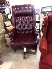 burgandy office chair.  Leather on coasters
$146.30