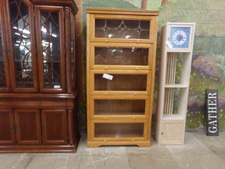 OAK BOOK CASE.  EACH SHELF HAS GLASS PROTECTION.  
$695.00