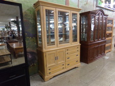HUTCH.  This is a light oak with a bit of a bleach accent.  Top has thick glass and 2 lights for evening glow.  Lower cabinet has 4 drawers and a cupboard area.  Very nice.
$695.00