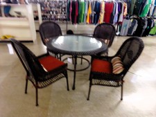 OUTDOOR WICKER.  ROUND TABLE HAS UMBRELLA HOLE.  Chairs are matching dark brown with red accented cushions.  
$575.00