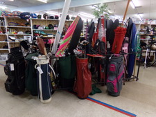 Find water skiis in the rack surrounded by golf club sets.  Also umbrellas for patio might be in this rack.  
the Red skiis to the right.
$19.10