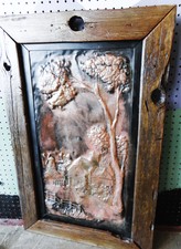 Hammered copper art work framed with a Barnwood frame.  Back is solid wood also.  At front counter area
$84.40