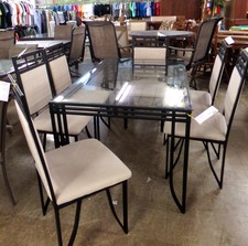 Black metal table and 6 chairs
Glass top/creamy white upholstry on chairs
$315.80