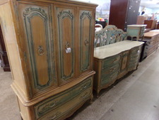LARGE BEDROOM ENSEMBLE.  A refurbished bedroom set antiqued with green accenting.  The wardrobe top has 3 drawers hidden behind the doors, also get long dresser, King headboard, 2 mirrors and 2 side tables.  
$464.10