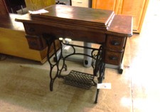 ANTIQUE TREADLE SEWING MACHINE.  It is a Honeywood sewing machine inside.  The cabinet and machine both need renovating done.  
Sold As Is.  antique
$200.00