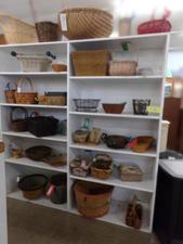 Just a couple columns of our baskets aisle.  All sizes and shapes including fruit bushels.  
Featured is a small wicker bowl basket.
$5.20